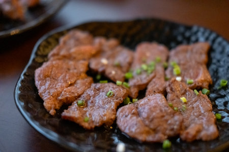 Japanese style sliceJapanese style Yakiniku, sliced grilled beef Zabuton or chuck meat on the plateの写真素材