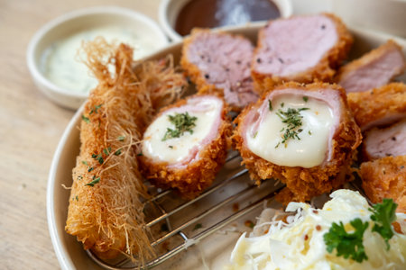 Sous vide pork katsu. Tonkatsu including loin, and fried shrimp. Fried Pork serve on plate in restaurantの写真素材