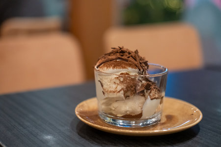 Square Tiramisu served in a cup in the cafeの写真素材