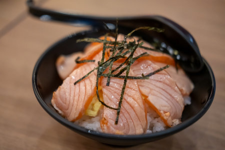 Grilled Salmon with rice, served in a bowl in the restaurantの写真素材