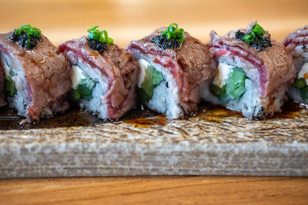 Sushi roll with cream cheese, served on plateの写真素材