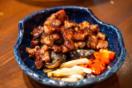 Grilled sliced marinated pork collar, served on the plateの写真素材