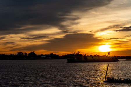 Sunset sky with the silhouette of riverside building