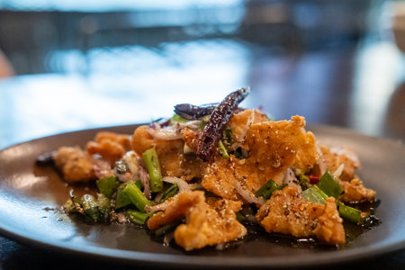 Spicy fried chicken served on plateの写真素材