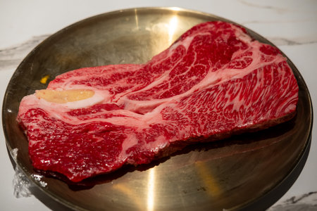Raw Sirloin Hanwoo Beef, marbled Korean Style Meat prepared on the plateの写真素材