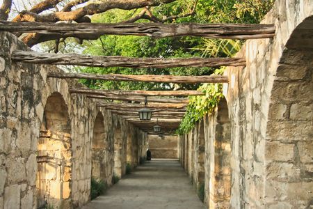 A timber lined colonnade at the Alamo in San Antonio Texasの写真素材