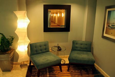 Two blue chairs in a modern seating areaの写真素材