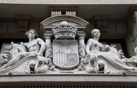 A sculpture piece on the side of an old buildingの写真素材