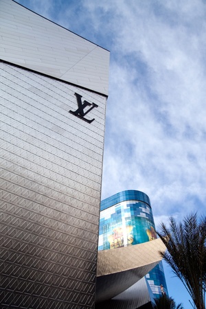December 30th, 2009 - Las Vegas, Nevada, USA - The facade of the Louis Vuitton Store front in The Crystals Mall.  The facade has become a interactive staple on the strip as it is made of of a silver backing with its logo repeated and at night features sevのeditorial素材
