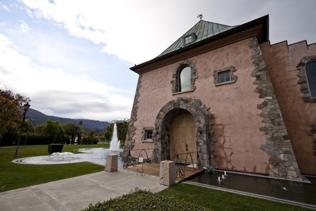 A house entrance surrounded by a pond and fountains のeditorial素材