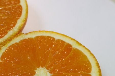 Orange fruit on a white background. Close-up of orange slices.の写真素材
