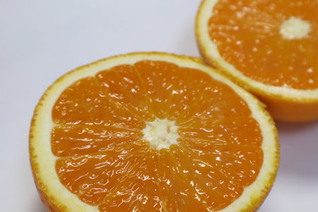 Slices of orange on a white background, close-upの写真素材