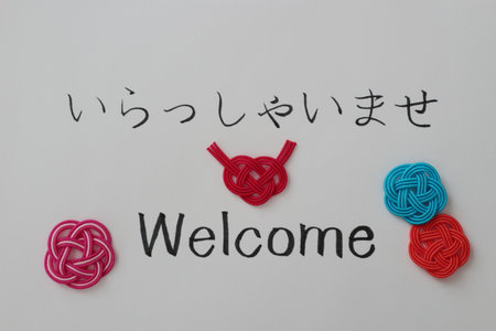 I wrote "welcome" in Japanese and English on white background. These were made by myself. The Japanese meaning is welcome. Welcome is called "Youkoso" in Japanese.の写真素材