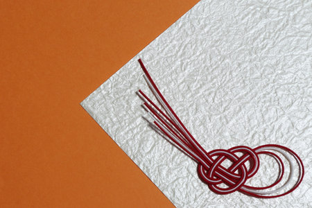 Japanese ornament with orange background. With place for text.の写真素材