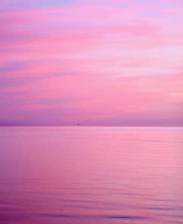 Beautiful seascape at sunset. Pink and purple colors.の写真素材