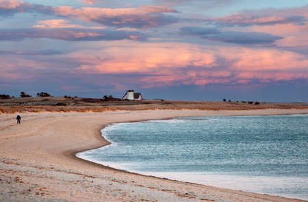 Sunset on the beach in Algarve region, Portugal.の写真素材
