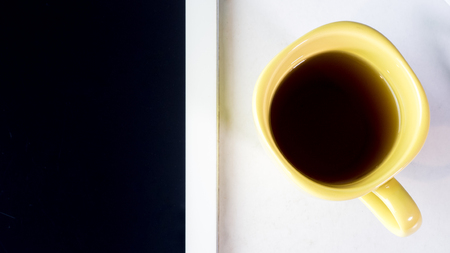 tablet  on white background  top view with coffee close upの写真素材