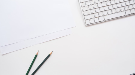 Office desk table with   keyboard and pencil Top view copy spaceの写真素材
