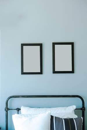 mock up picture frame in  bedroom interior backgroundの写真素材