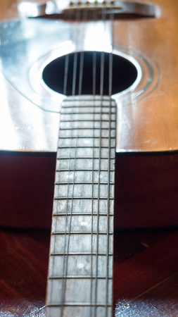 close up guitar on wood background