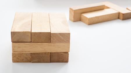 wooden block  to make structure on white background,planning in business model successの写真素材