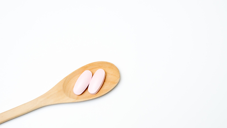 medicine on spoon wood with backgroundの写真素材