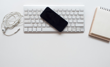 Office desk table Top view keyboard with smart phoneの写真素材