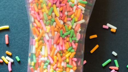 rainbow candy colorful black background