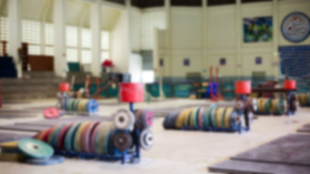 Blur  Gym equipment with steel plates are coated with colorful rubberの写真素材