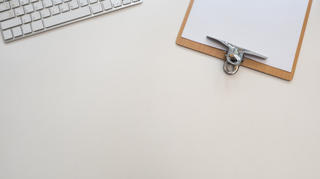 top view paper board with keyboard  white backgroundの写真素材