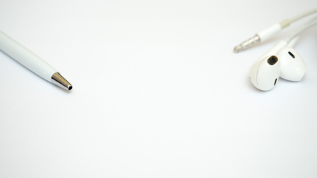 Pen and earphone background smart phone close upの写真素材