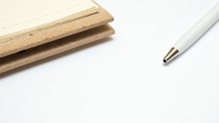 notebook and pen with white backgroundの写真素材