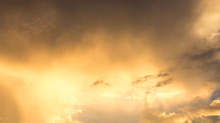 Cloudy sky. Evening sun backgroundの写真素材