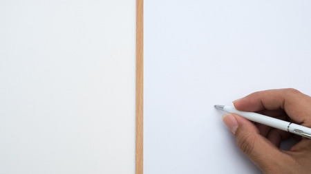 top view paper board with hand write pen and white backgroundの写真素材