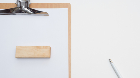 top view paper board with woodenblock white backgroundの写真素材