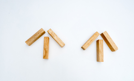 Arrow wooden block white backgroundの写真素材