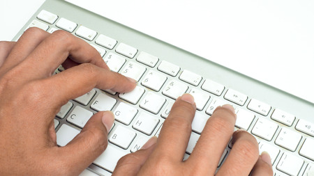 keyboard with hand on white background