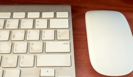 keyboard and mouse on wood background