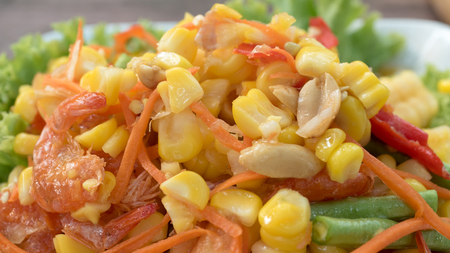 Papaya salad with corn or Som Tum Kao Pod , Thai style sweet corn spicy salad close-upの写真素材