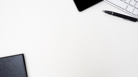 Office desk table with smart phone, mouse, keyboard,Envelope,Top view with  copy spaceの写真素材