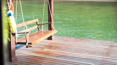 Swing on a wooden raft relax timeの写真素材