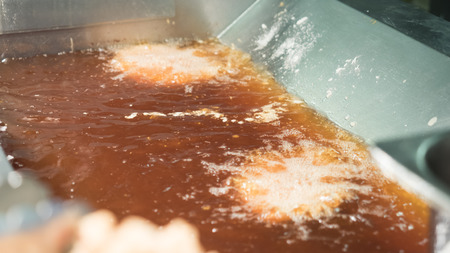 Boiling oil is frying chicken