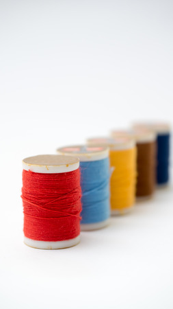 Sewing thread colourful thread on white background