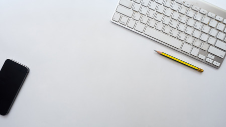 smart phone and keyboard on white background business conceptの写真素材