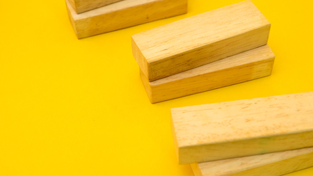 wood block close up yellow backgroundの写真素材