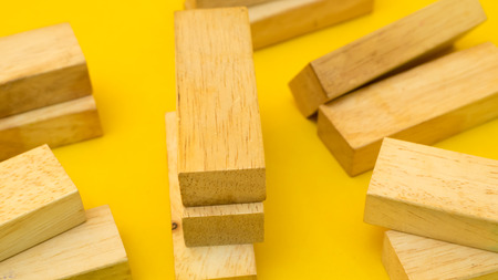 wood block close up yellow backgroundの写真素材