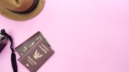 passport thailand and hat on pink background.Travel conceptの写真素材