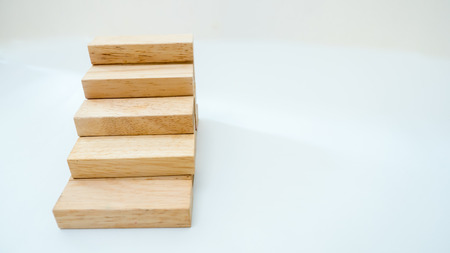 Wood block stacking as step stair with Business concept for growth success processの写真素材