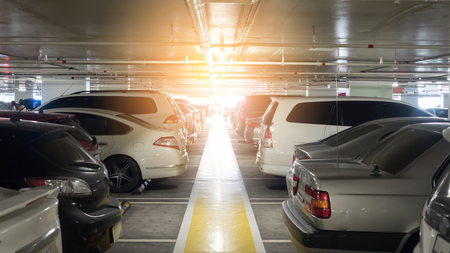 Cars parked in the parking lot and sunの写真素材