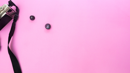 Camera and lens on pink background.Travel conceptの写真素材